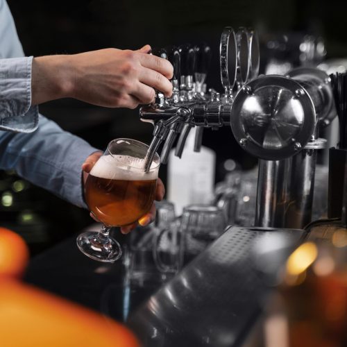close-up-hand-pouring-beer-glass close-up-hand-pouring-beer-glass